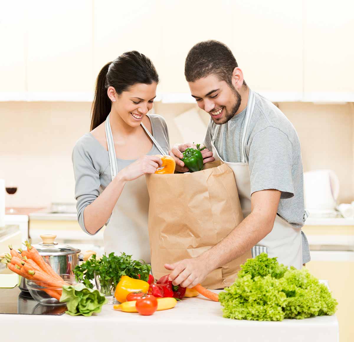 Couple unpacking groceries recommended by DIYK staff