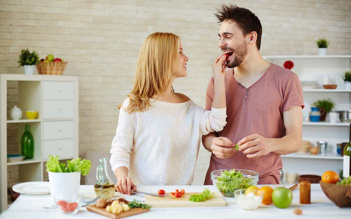 Couple playfully learning how to make healthy eating choices